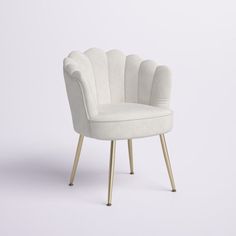 a white chair sitting on top of a wooden leg