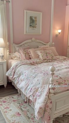 a bedroom with pink walls and white furniture