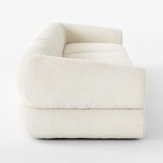 a white chair that is sitting in the middle of some kind of flooring material