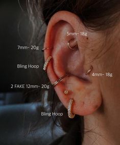 an ear with three different types of piercings on it and the measurements for each one