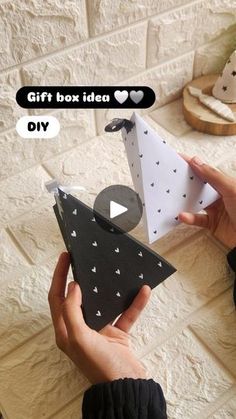 someone is holding an origami boat in their hand and it says gift box idea diy