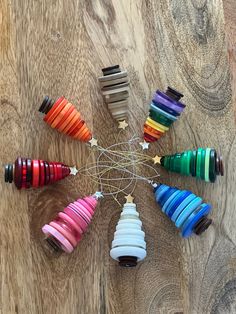 a group of colorful objects sitting on top of a wooden table