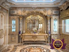 the bathroom is decorated in gold and white with an elaborate mirror on the wall above the sink