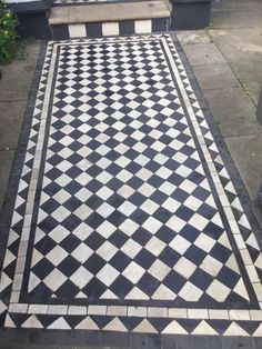 a black and white checkerboard pattern on the ground