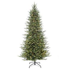 a tall artificial christmas tree with lights on it's top and bottom branches, in front of a white background