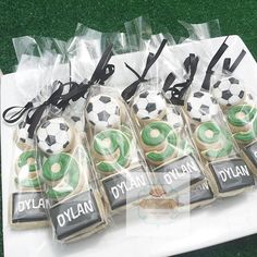 some cookies are wrapped in plastic and have soccer balls on them