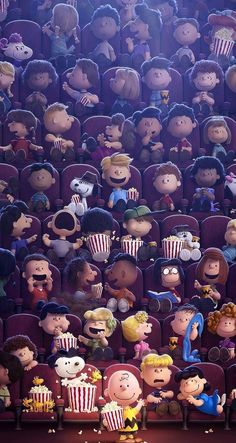 the peanuts movie poster is shown in front of a crowd of people sitting in chairs