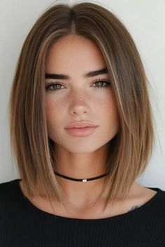 Woman with shoulder-length brown hair, wearing a black choker and a black top, posing against a plain background. Long Bob Straight Hair Layers, Straight Lob Haircut Shoulder Length, Shoulder Length Bob Curtain Bangs, Shoulder Length Haircut With Side Bangs, Just Above The Shoulder Length Hair, Shoulder Length Hair Straight Layers, Above The Shoulder Haircut Straight, Fall Shoulder Length Hair, Lob Haircut Shoulder Length