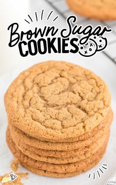 a stack of brown sugar cookies sitting on top of a white plate next to a cooling rack