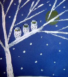 an image of three owls sitting on a tree branch in the snow with drops of water