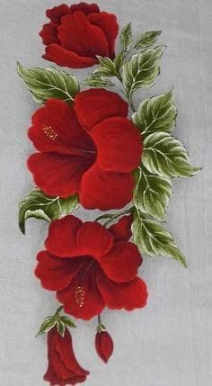 three red flowers with green leaves on a white table cloth, and one flower has been embroidered onto it