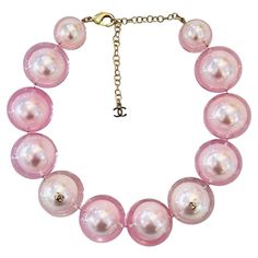 Rare Item - Chanel Ltd Edition 'CC' Logo Pearl Choker Necklace Oversized baby pink faux pearl choker encased in clear resin and detailed with gold 'CC' logo embellishments. Adjustable lobster clasp and a dangle chain with 'CC' logo. From Summer 2017 Collection. Size – One Size Condition – Very Good Composition – Faux Pearls Comes with – Necklace Only Cher Horowitz Jewelry, Star Necklace Gold, Chanel Necklace, Chanel Pearls, Pink Chanel, Pearl Choker Necklace, Chanel Vintage, Pierced Jewelry, Chanel Jewelry