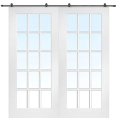 a white double door with glass panels