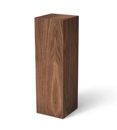 a tall wooden object on a white background