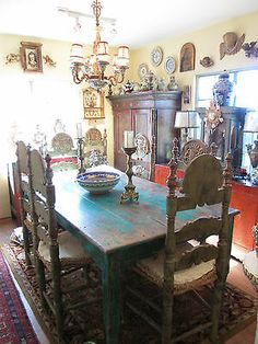 a dining room table with chairs and a bowl on it