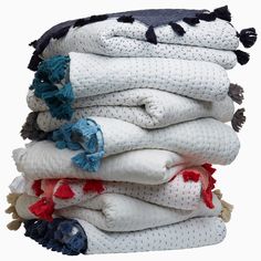 a stack of folded towels on top of each other