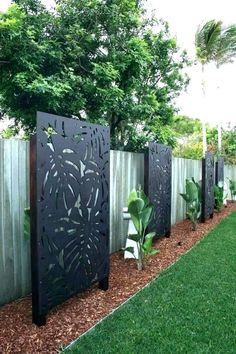 a fence that has some plants in it