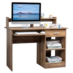 a computer monitor sitting on top of a wooden desk