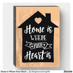 a black and white sign that says home is where your heart is