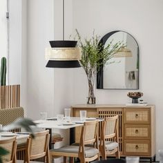 a living room with white couches and a wooden table