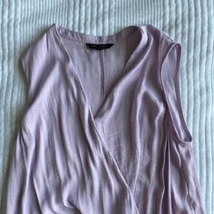 The Pictures Don’t Do The Color Justice! It’s An Amethyst Lavender. Truly Gorgeous And Lovely Flowy Silky Material Never Worn But No Tags. Size Small! Purple V-neck Blouse For Day Out, Lavender V-neck Summer Blouse, Feminine Lavender V-neck Top, Lavender Tops For Spring Layering, Purple V-neck Blouse For Summer, Purple Sleeveless Top For Day Out, Purple V-neck Top For Day Out, Elegant Mauve Tops For Spring, Fitted Lavender V-neck Blouse