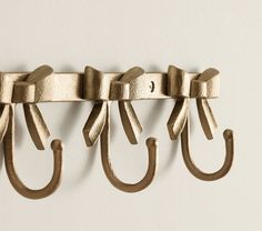 an image of metal hooks on the wall