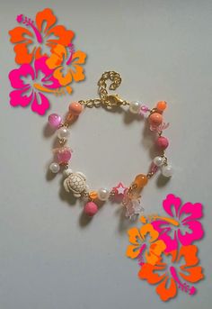 Gorgeous hibiscus bracelets, perfect for the summer! Cute Orange Bracelet, Pink And Orange Jewelry, Bohemian Flower Bracelets For Vacation, Pink Flower-shaped Jewelry For Vacation, Multicolor Flower Jewelry For Beach, Pink Flower Jewelry For Vacation, Coral Beaded Beach Bracelets, Flower Shaped Bracelets For Beach, Coral Beaded Bracelets For Beach