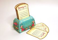 a small wooden calendar sitting on top of a table