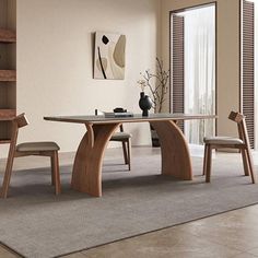 a modern dining table and chairs in a room