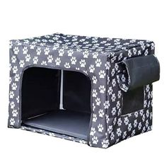 a black and white dog crate with paw prints