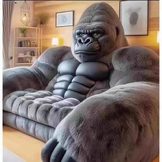 a large gorilla sitting on top of a couch