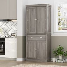 an image of a kitchen setting with grey cupboards