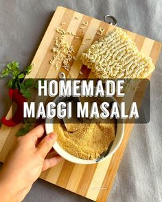 someone is making macaroni masala on a cutting board with the words homemade