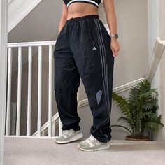 Classic Adidas Wide Leg Oversized fit windbreaker Track Pant 🍂 low-waisted toggled hem to adjust   Tag says Size XL and sizing is flexible due to drawcord waist, unisex  32" inner leg Seen on size 10uk, 5'4" for reference  overall Good condition joggers sportswear trackie track-pant tracksuit bottom sweatpants casual streetwear baggy pants parachute pants y2k 00s gymwear activewear unisex  63 Casual Adidas Joggers, Windbreaker Track Pants, Track Pant, Baggy Pants, Baggy Pant, Low Waisted, Casual Streetwear, Gym Wear, Womens Sweatpants