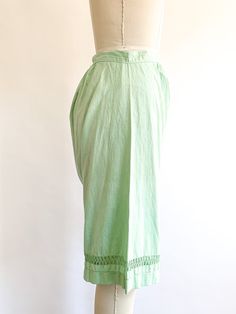 Feminine cotton summer shorts. Layer under a dress or wear with a cute crop or tank top. Easy and wearable, hand dyed a minty green shade. Fabric: CottonFit: XSEra: 1920's Measurements:Waist 25"Hips 59"Rise 16"Inseam 12"Length 20.5"Leg opening 11.5" Condition: Great. Dye imperfections may be present with hand dyed items. Old cottons can have signs of wear or minuscule holes. See all images. Green Relaxed Fit Wide Leg Shorts, Green Cotton Bottoms For Daywear, Green Cotton Summer Pants, Green Summer Cotton Pants, Summer Green Cotton Pants, Green Wide Leg Bottoms For Daywear, Green Cotton Pants For Daywear, Green Cotton Pants For Summer, Bohemian Bottoms For Spring Daywear