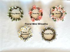 four different wreaths with flowers on them and the words floral mini - wreaths