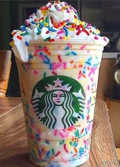 a starbucks drink with sprinkles and white frosting