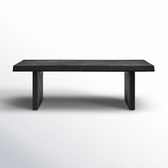 a black bench sitting on top of a white floor