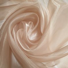 the fabric is very soft and shiny with some light pink colors on it's surface