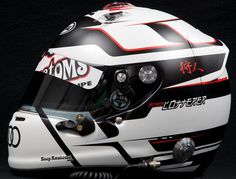 the helmet is white and black with red stripes