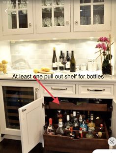 an open cabinet with bottles in it