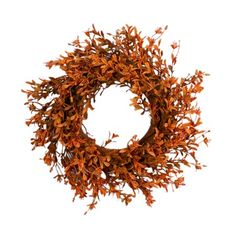 an orange wreath is hanging on the wall