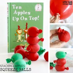 the stacking apples squeezee balls are on top of each other in front of a book