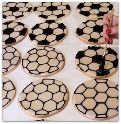 the cookies are decorated with black and white soccer balls