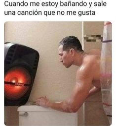 a man that is standing in front of a heater with his hand on the wall