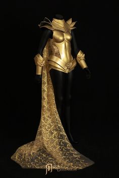 a gold and black costume on display against a black background