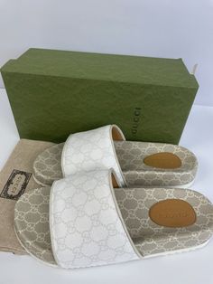 Shoes are new in box. Slight discoloration on soles from being tried on for fit. Please review photos. This Gucci slide takes on a refined look without compromising the sporty feel. It is crafted in Gucci’s signature GG Supreme canvas and has a ribbed rubber sole. **Final sale. Please know your size. Returns will not be accepted. White Gucci Shoes, Gucci Slide, White Slides Sandals, White Slides, Mens Shoes Sandals, Slides Sandals, Gucci Shoes, Mens Sandals, Men's Shoes