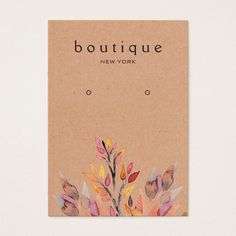 a business card with watercolor leaves and the words boutique new york written on it