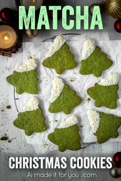 green christmas cookies with white frosting on top