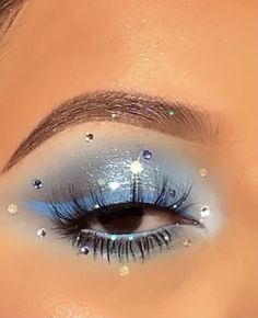 Blue Eye Makeup With Gems, Blue Sparkle Eye Makeup, Blue Makeup Looks With Gems, Blue Prom Makeup For Brown Eyes, Under The Stars Makeup, Sparkly Blue Makeup, Quinceanera Makeup Blue Silver, Light Blue Makeup With Gems, Star Themed Makeup